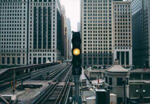 Image of a yellow train signal in a city